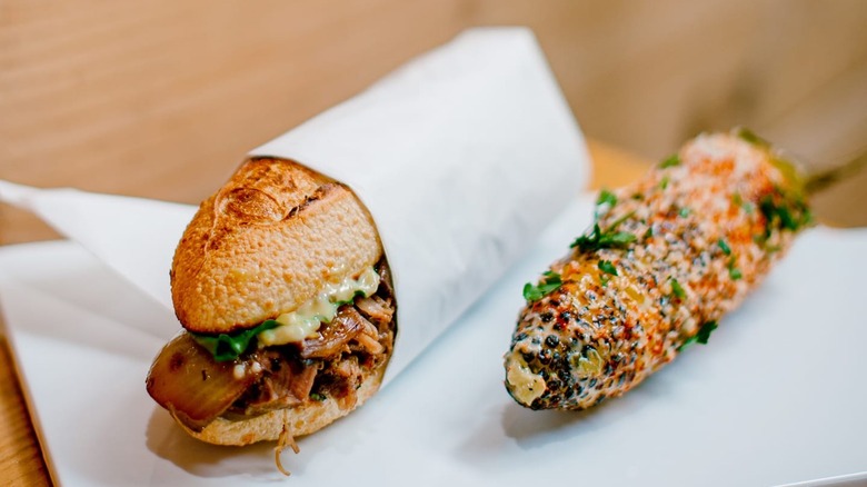 Un Bien sandwich and grilled corn on cob