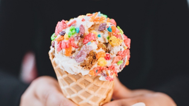 Ice cream cone with cereal on top