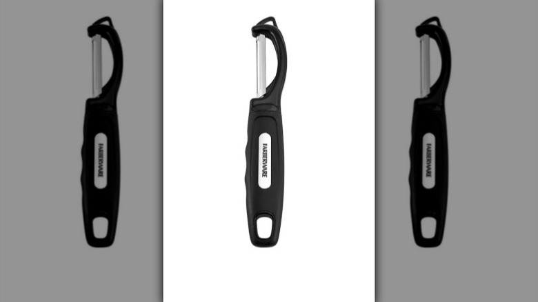 Euro peeler with metal blade and black handle on white background