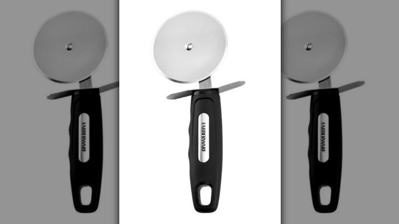 Stainless steel pizza cutter with metal blade and black handle on white background