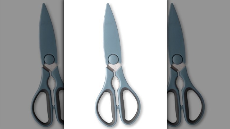 Dusty blue kitchen shears on white background