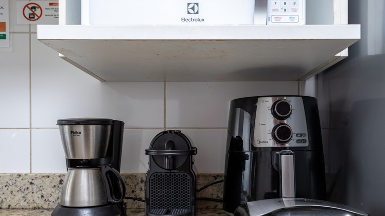 Multiple kitchen appliances on countertop