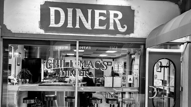Black and white phot of Chili Mac's Diner window front