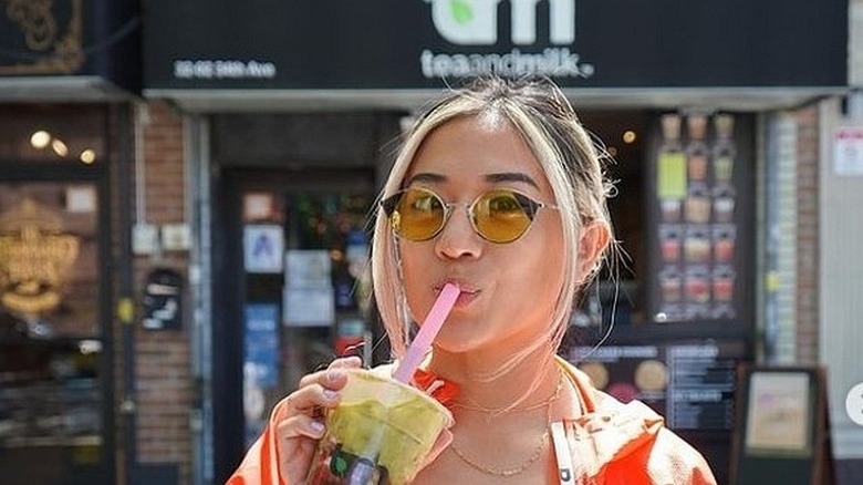 Woman drinking boba tea