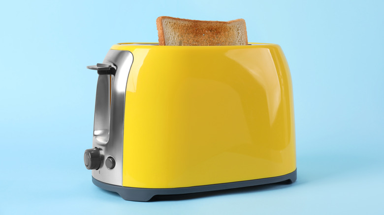 yellow retro toaster with toast