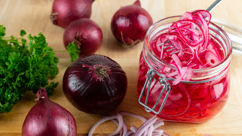 Red onions in jar