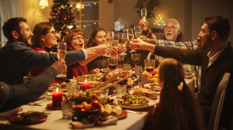 Family toasting during Christmas dinner