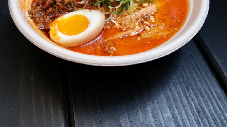 Ramen with pork, greens, and an egg