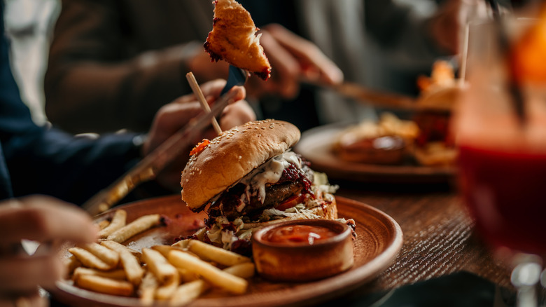 Burger and fries on a plate at a restaurant