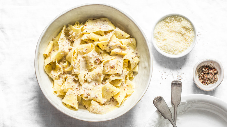 Pasta with parmesan cheese, butter, and nuts