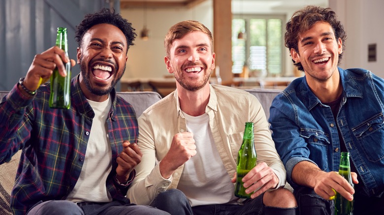 men smiling with beer 