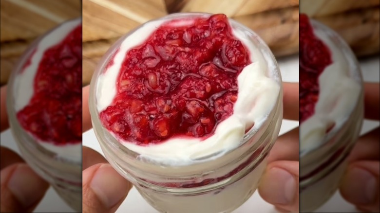 Protein cheesecake cups with mashed raspberries