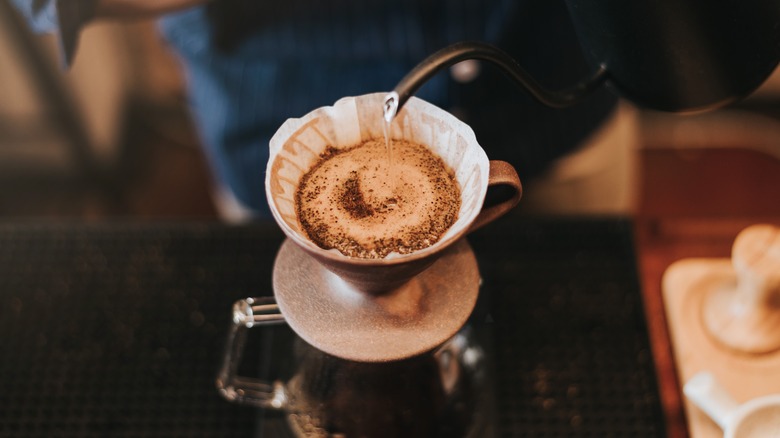 water pouring into coffee grounds 