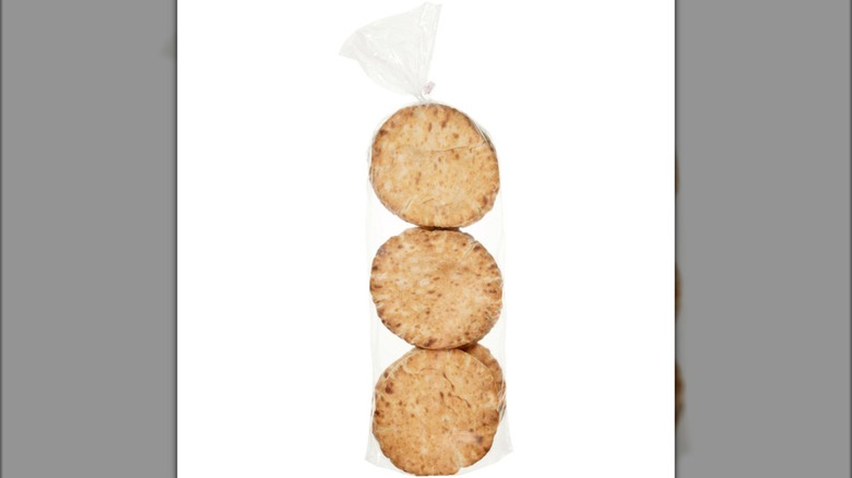Nine round pitas in three stacks of three, in a plastic bag