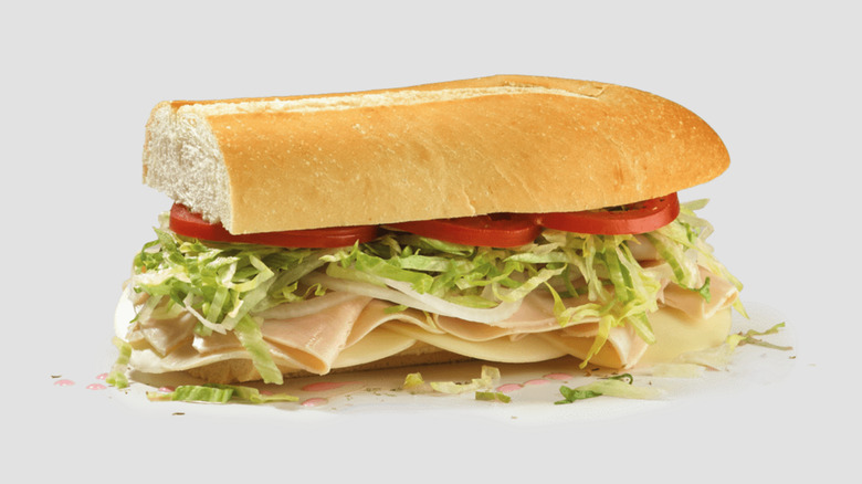 Jersey Mike's Turkey and Provolone sub against beige background.