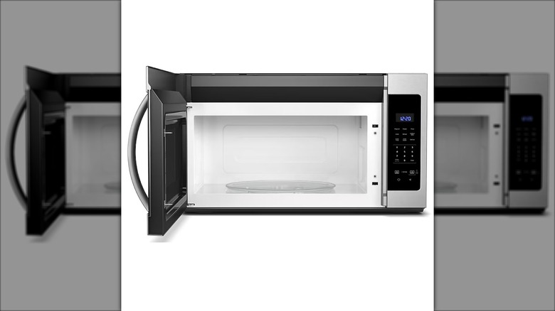 Open view of the Whirlpool 1.7-cubic-foot over-the-range microwave against a white background.