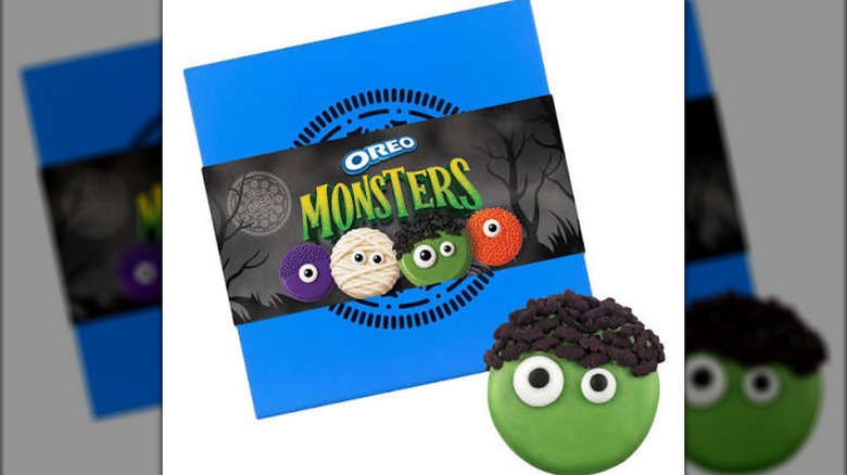 OREO Monsters Cookie Collection package in background with green frankenstein cookie in the front