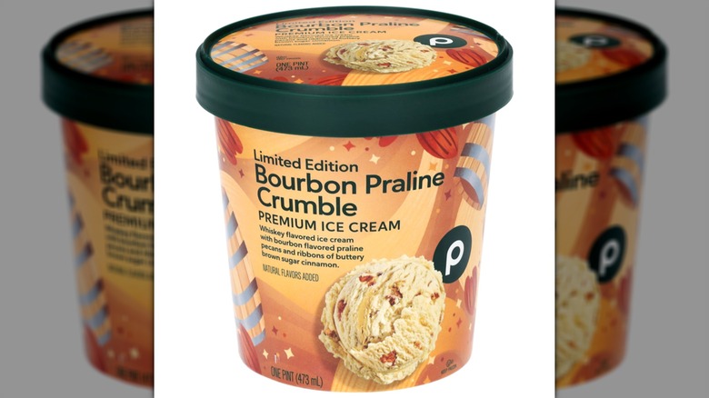 A pint of Publix Limited Edition Bourbon Praline Crumble Ice Cream on a white background