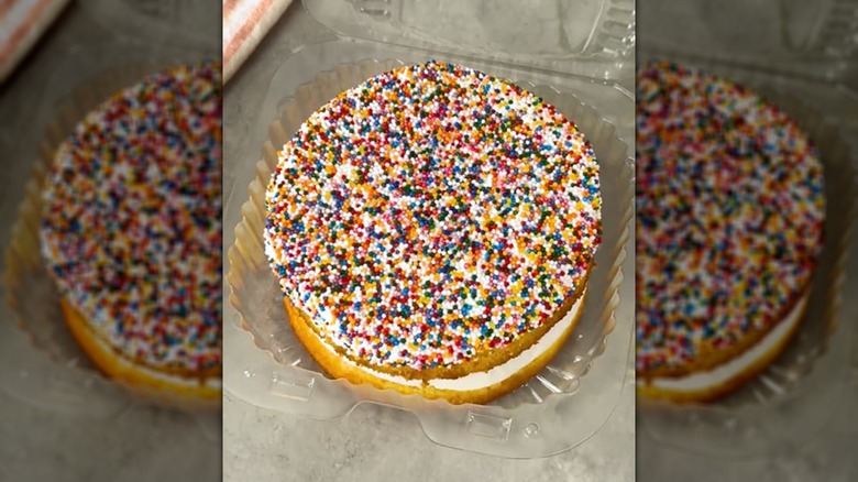 A Publix vanilla Sprinkle Crunch Shortcake in a plastic container