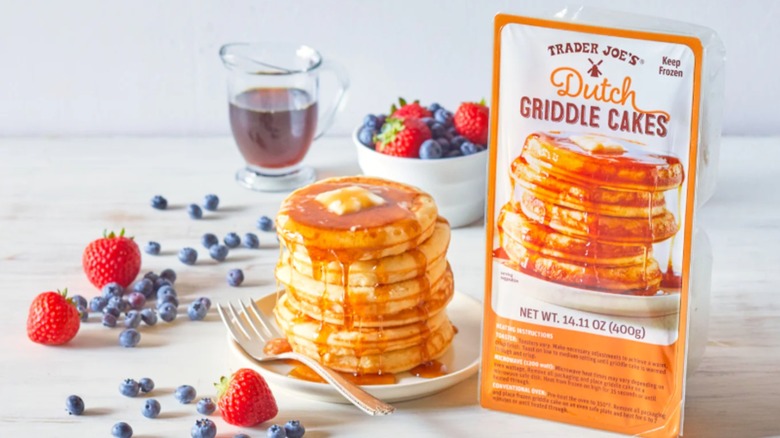 Trader Joe's Dutch Griddle Cakes with stack of pancakes fruit and tea with the orange package nearby.
