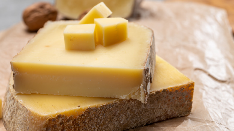 Chunks of French Comté cheese on butcher paper