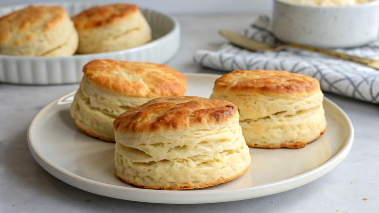 Three buttermilk biscuits on a white plate