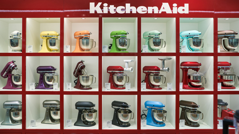 Kitchenaid stand mixers in a variety of colors on a store display