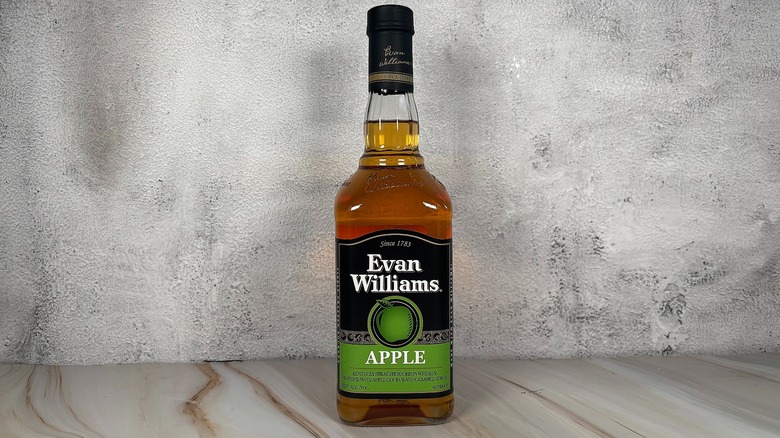 Bottle of Evan Williams apple whiskey on grey background