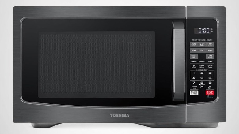 a silver and black Toshiba countertop microwave