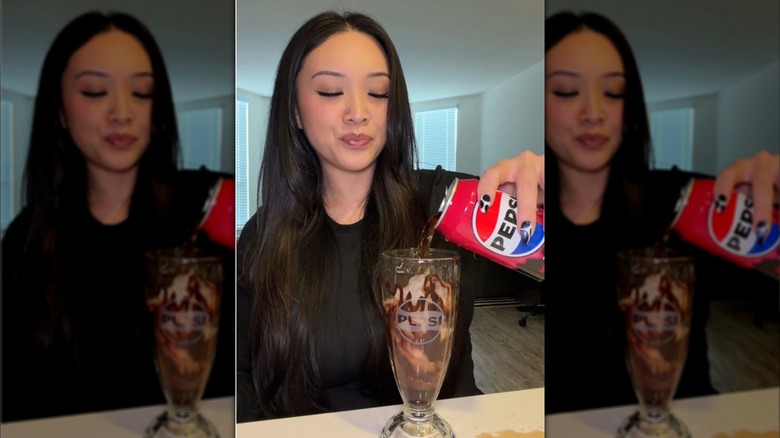 Woman Pepsi into a fountain fountain glass with brown drink