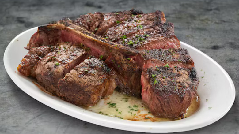 a porterhouse steak sliced and presented on a plate