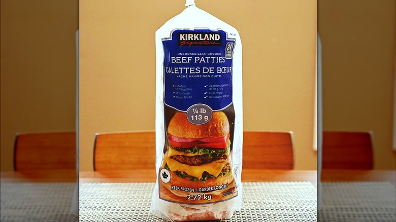 A bag of Kirkland Signature beef patties on a kitchen table