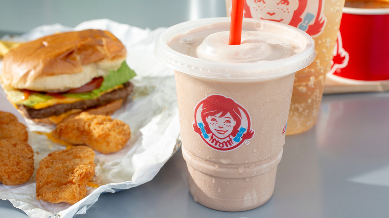 wendys burger and nuggets with frosty in the foreground