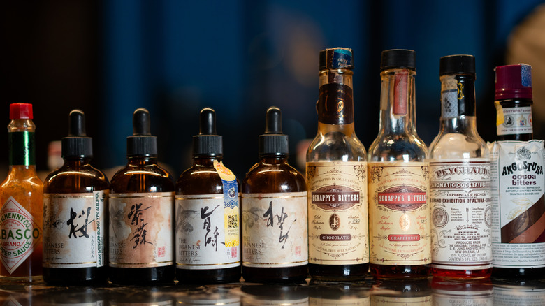 A row of bitters on a bar, including four types from The Japanese Bitters