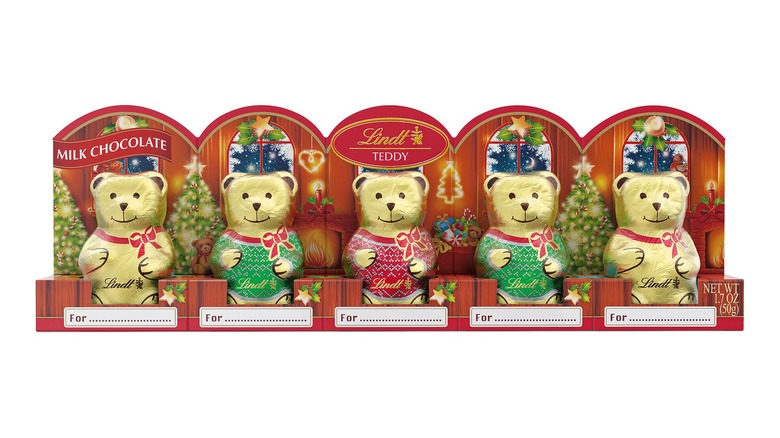 Five hollow chocolate bears wrapped in gold tin foil of various Christmassy designs