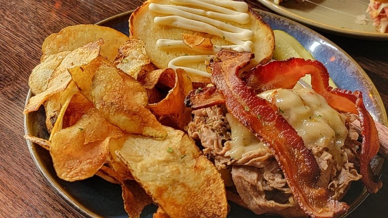 Chips and sandwich on plate 