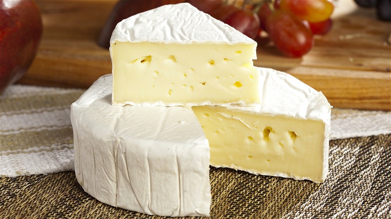 Brie cheese round with slice 