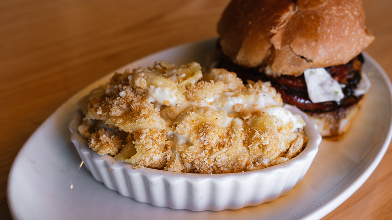 Serving of Salt + Smoke mac and cheese with burger