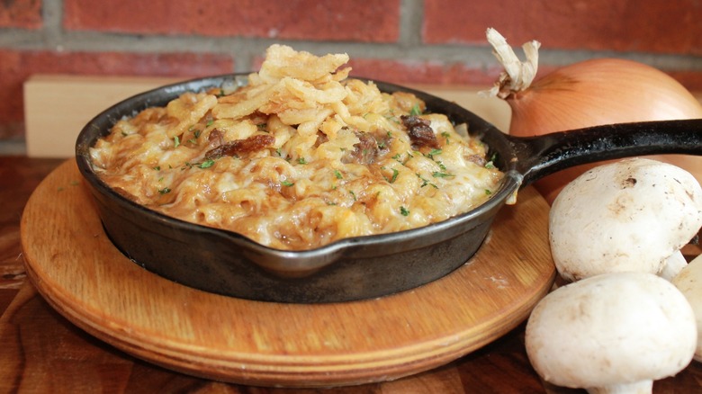 A skillet of Mr. Mac's macaroni and cheese on countertop