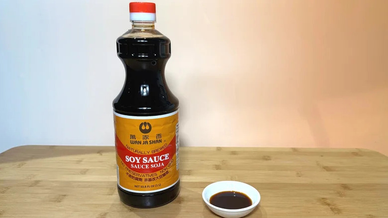 Bottle of Wan Ja Shan soy sauce on table