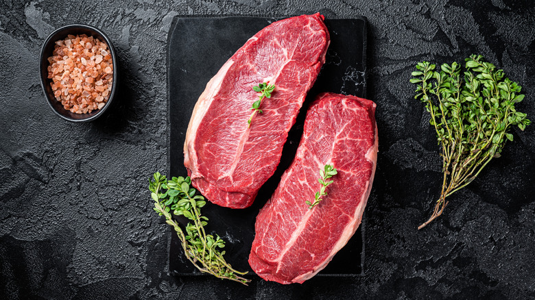 Pair of blade steaks with salt and herbs