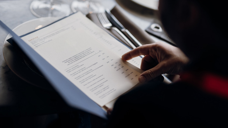 Diner looking over menu 