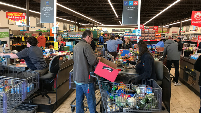 Aldi cashiers ringing up and checking out customers