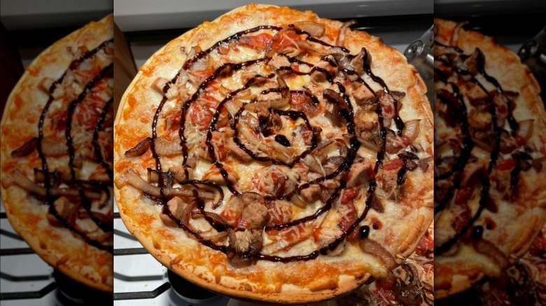 Mama Cozzi pizza with sauce and added toppings