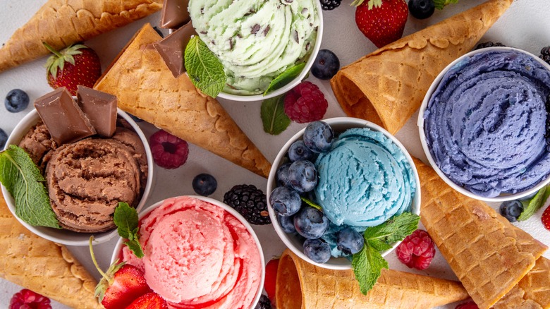 Bowls of different ice cream flavors and cones
