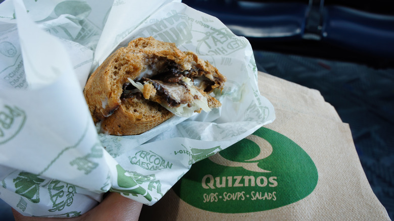 Quiznos sandwich and branded napkins