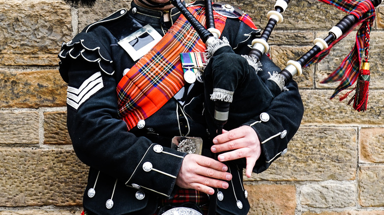 Person playing bagpipes 