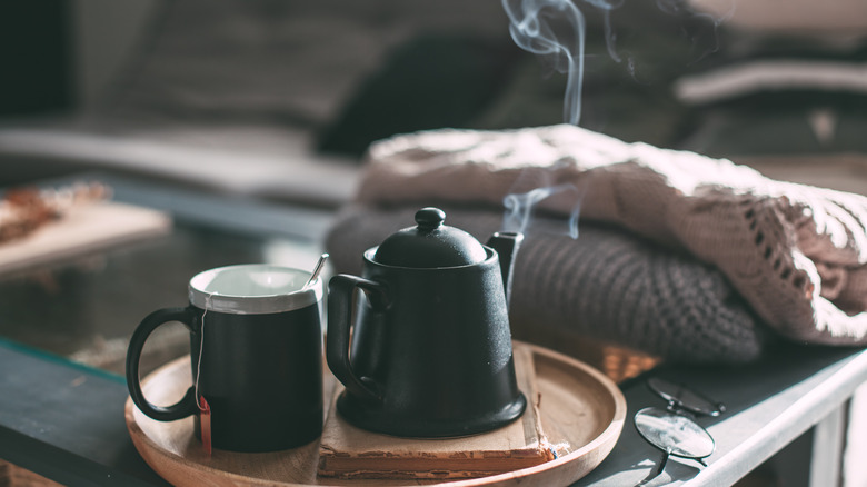 Steaming teapot and mug 