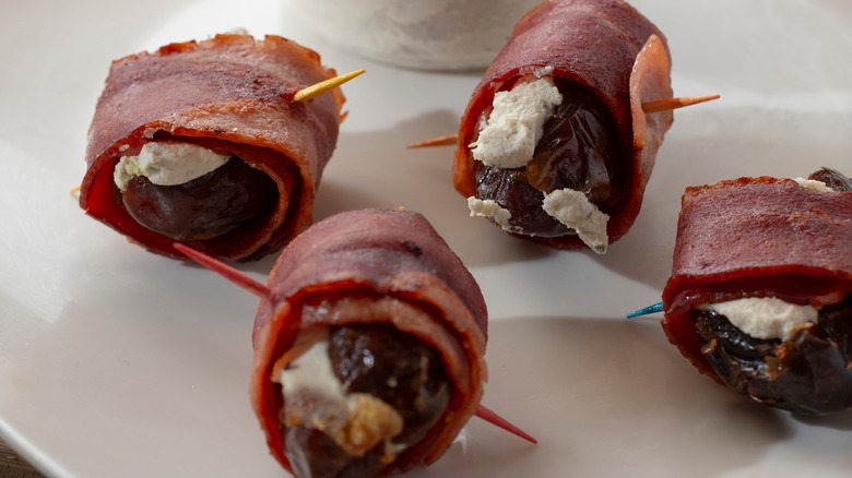 Devils on horseback on a white plate