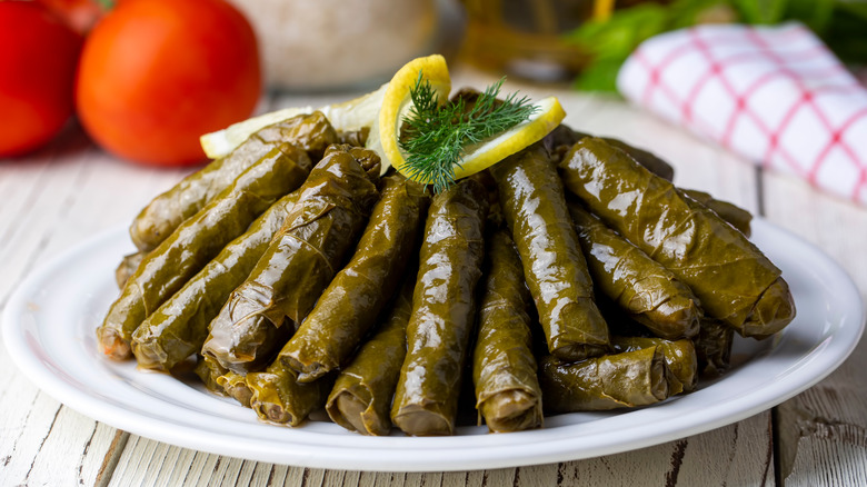 Dolmas on a plate with lemon